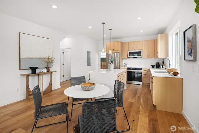 8018 24th Ave NW, Seattle, WA 98117 - dining space with light wood-style flooring, recessed lighting, baseboards, and electric panel