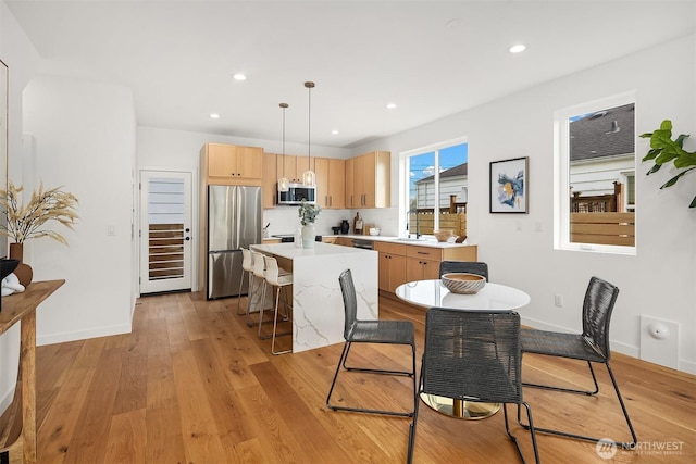 8018 24th Ave NW, Seattle, WA 98117 - dining area featuring light wood finished floors, baseboards, and recessed lighting