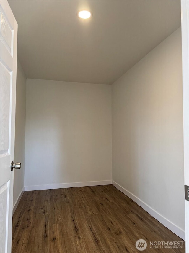 unfurnished room with dark wood-style floors, baseboards, and recessed lighting