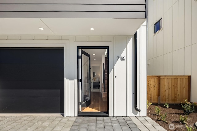 entrance to property featuring fence