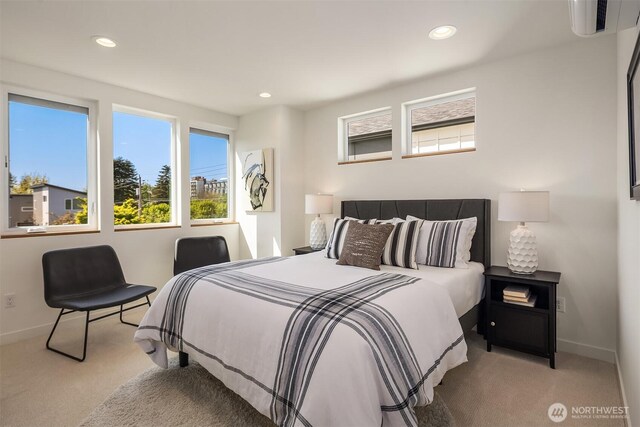 bedroom featuring carpet floors, baseboards, and multiple windows