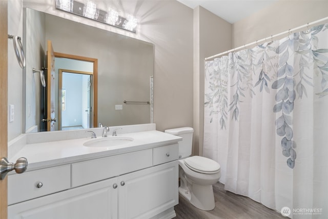 17610 134th Ln SE, Renton, WA 98058 - bathroom featuring vanity, wood finished floors, toilet, and curtained shower
