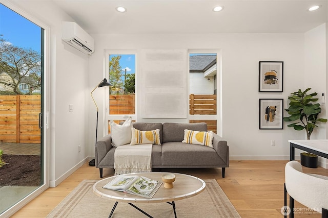 8018 24th Ave NW Unit B, Seattle, WA 98117 - living room with recessed lighting, light wood-style flooring, baseboards, and a wall unit AC