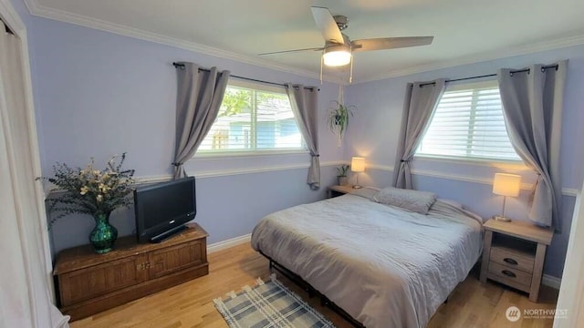 7005 226th Pl SW, Mountlake Terrace, WA 98043 - bedroom featuring light wood-style floors, baseboards, ornamental molding, and ceiling fan