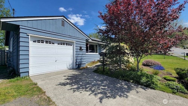 7005 226th Pl SW, Mountlake Terrace, WA 98043 - view of home's exterior featuring a lawn, a garage, and concrete driveway