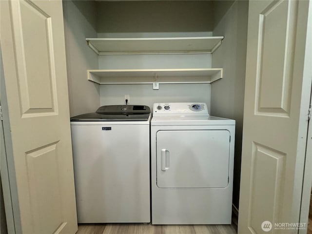 washroom with washer and dryer and laundry area