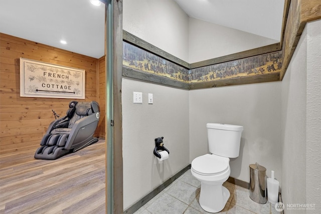 17132 156th Ln SE, Yelm, WA 98597 - bathroom featuring toilet, tile patterned floors, and wood walls