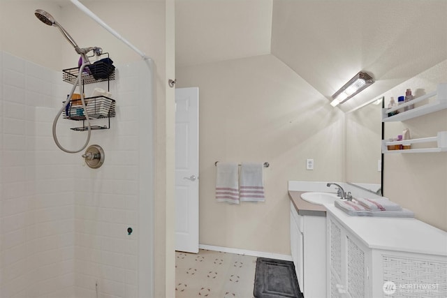17132 156th Ln SE, Yelm, WA 98597 - bathroom with tile patterned floors, a tile shower, baseboards, and vanity