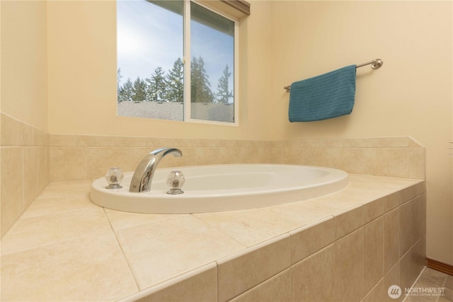 bathroom with a garden tub