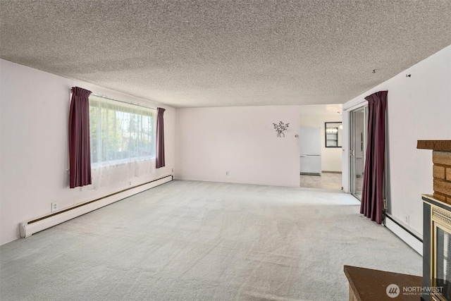 unfurnished living room with a baseboard radiator, carpet, a textured ceiling, and a stone fireplace