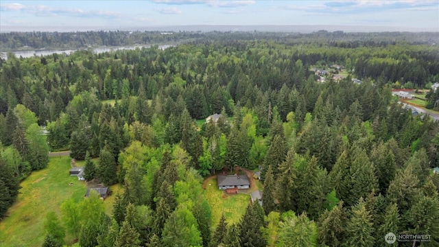 bird's eye view featuring a wooded view