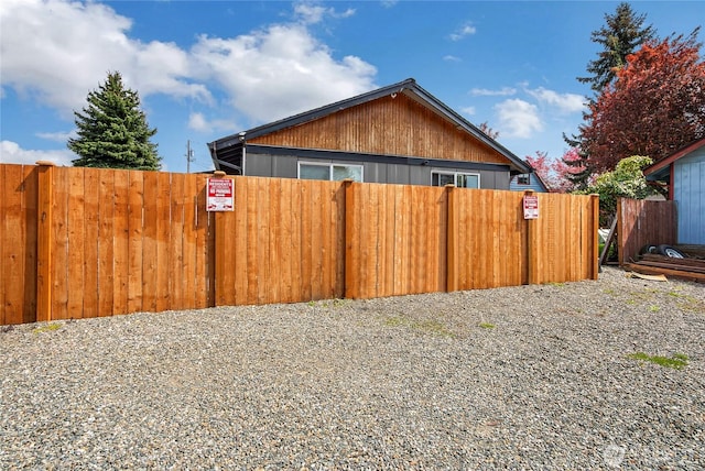 view of home's exterior with fence