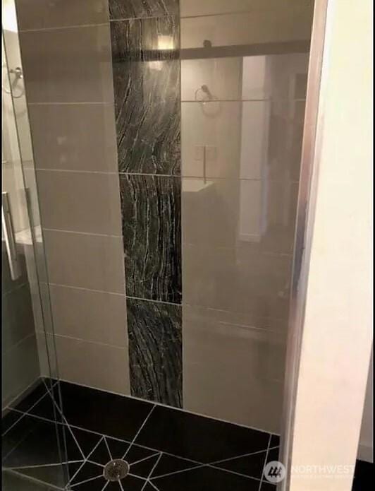 full bath featuring a stall shower