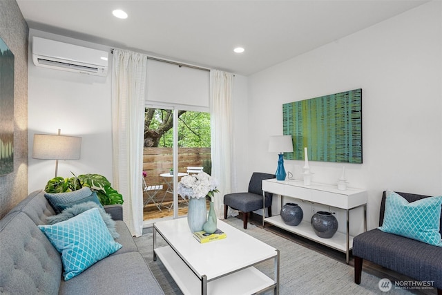 living room featuring recessed lighting, a wall mounted air conditioner, and wood finished floors