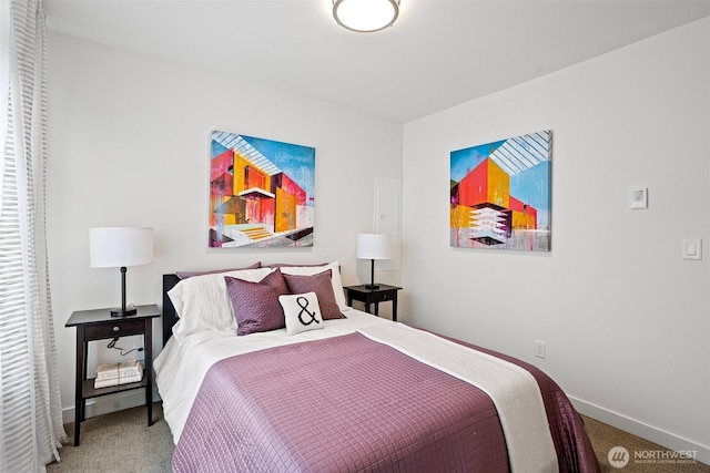 carpeted bedroom featuring baseboards