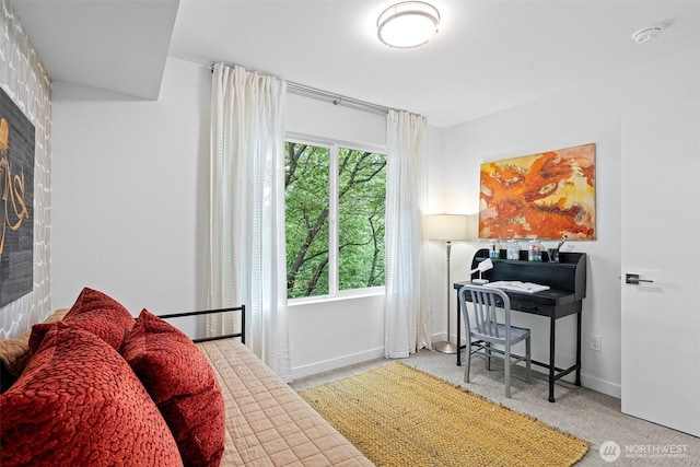 carpeted bedroom with baseboards