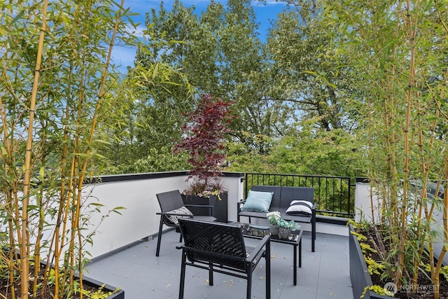 balcony with an outdoor living space and a patio