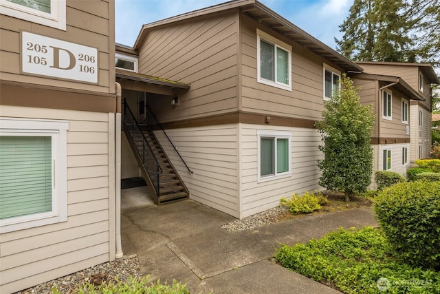 12621 NE 130th Way # D106, Kirkland, WA 98034 - view of side of home featuring stairs
