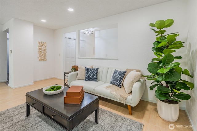 12621 NE 130th Way # D106, Kirkland, WA 98034 - living room with recessed lighting, baseboards, and wood finished floors