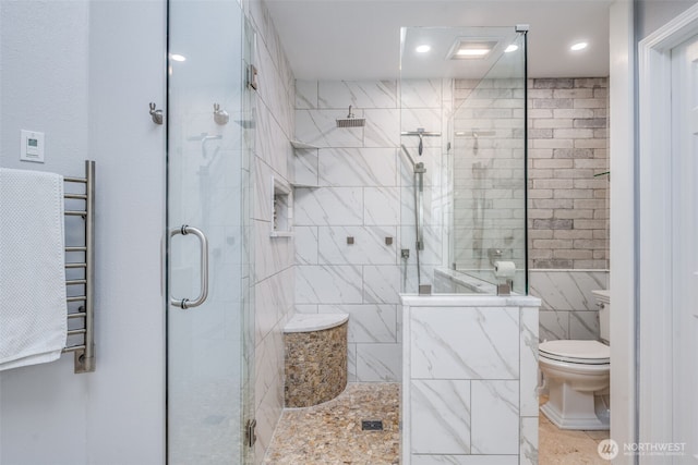 bathroom featuring tiled shower, toilet, a towel warming rack, tile patterned floors, and recessed lighting