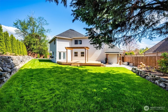 rear view of house with a wooden deck