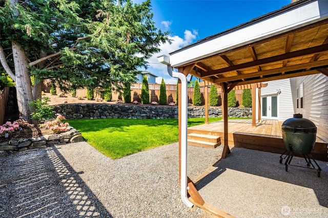 view of patio featuring french doors and a deck