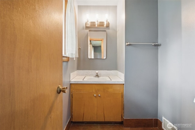 bathroom with vanity and visible vents