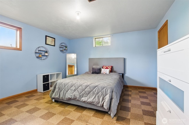 bedroom featuring baseboards