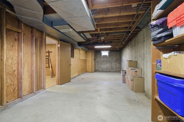 unfinished basement featuring visible vents