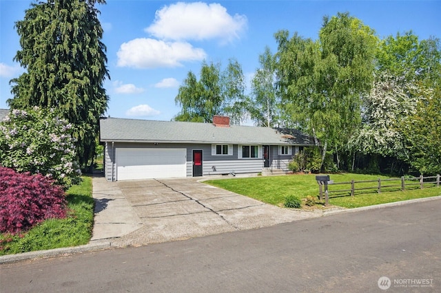 ranch-style home featuring fence, a garage, a front yard, a chimney, and driveway