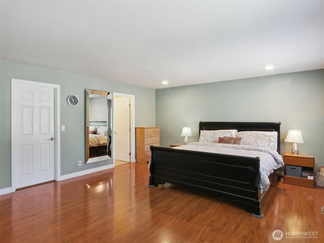 bedroom featuring recessed lighting, baseboards, and wood finished floors