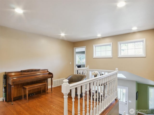 interior space with visible vents, recessed lighting, baseboards, and wood finished floors