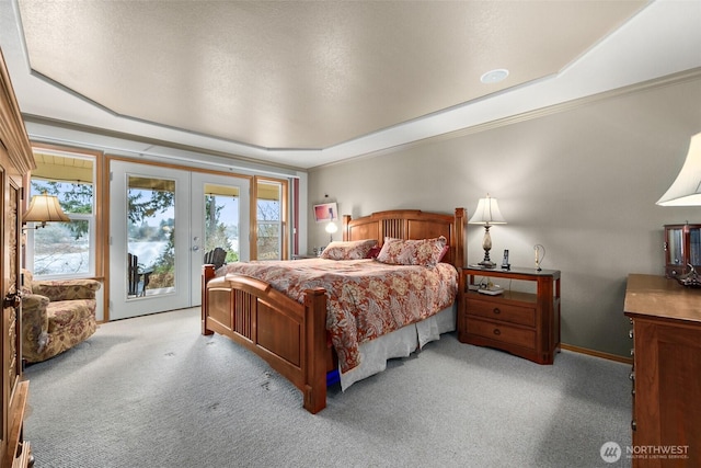 bedroom with carpet floors, ornamental molding, access to exterior, and french doors