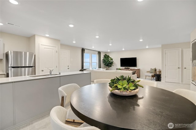 dining space featuring visible vents and recessed lighting
