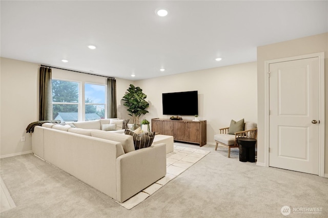 living area featuring light colored carpet, recessed lighting, and baseboards