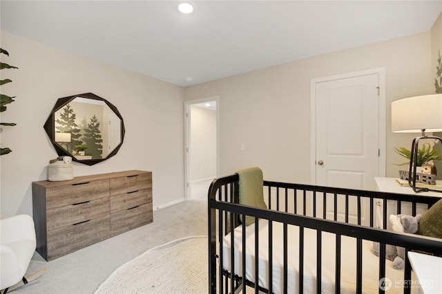 bedroom with baseboards, light carpet, and recessed lighting