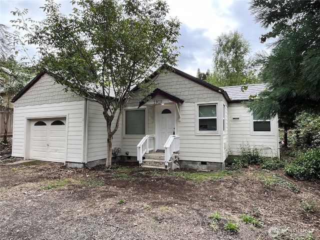 view of front of home featuring a garage and crawl space