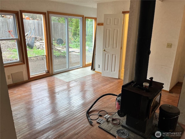 living area with a healthy amount of sunlight and light wood-style flooring
