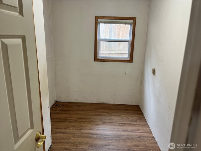 empty room with wood finished floors
