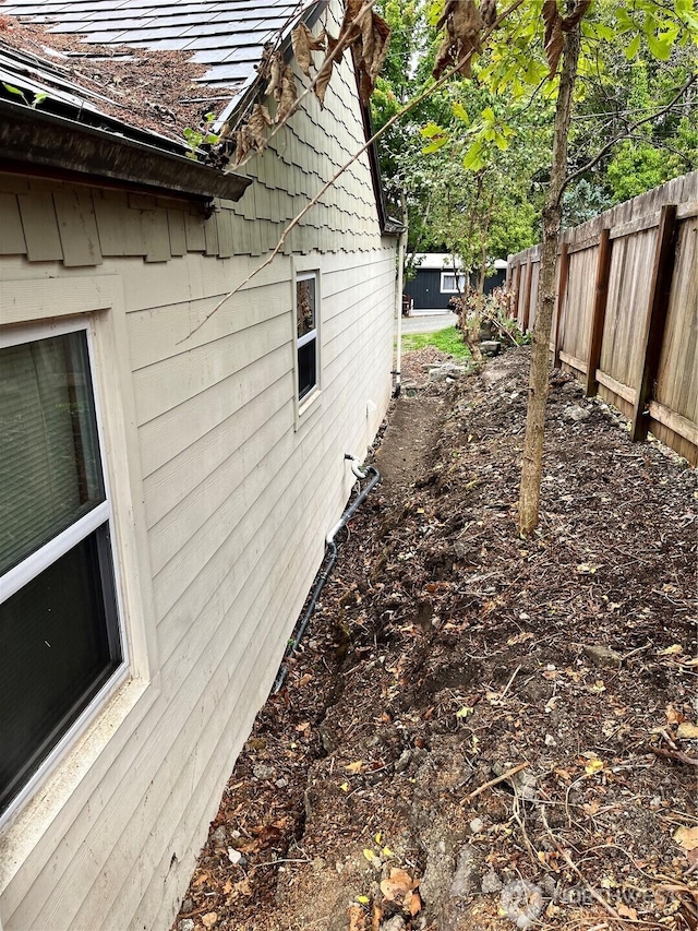 view of property exterior with fence