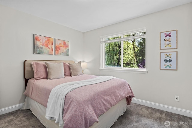 carpeted bedroom with baseboards