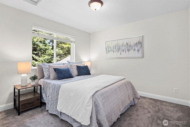 carpeted bedroom with baseboards