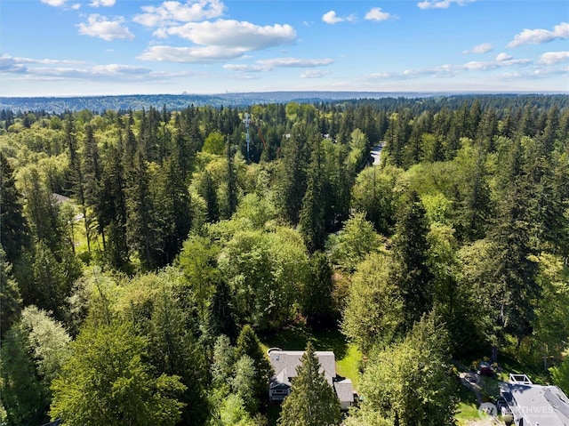 drone / aerial view with a view of trees