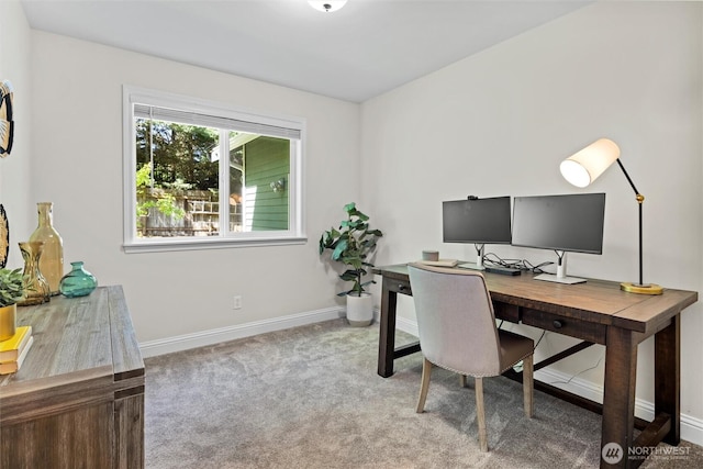 home office with baseboards and carpet flooring