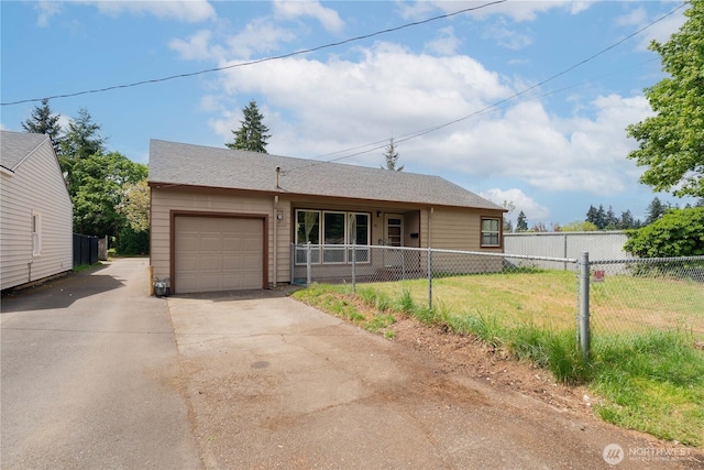 view of front facade with an attached garage, fence, and concrete driveway