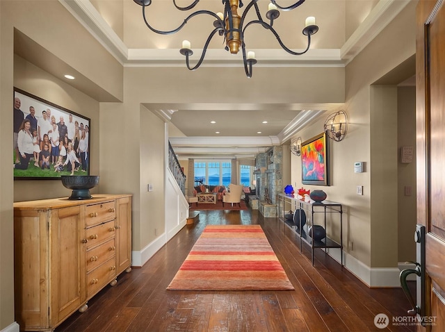 5844 Mutiny Bay Rd, Freeland, WA 98249 - foyer with crown molding, baseboards, a chandelier, and dark wood-type flooring