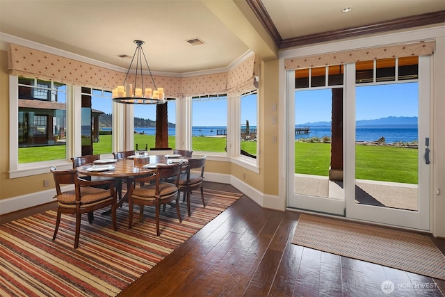 5844 Mutiny Bay Rd, Freeland, WA 98249 - dining space featuring crown molding, baseboards, a notable chandelier, and visible vents