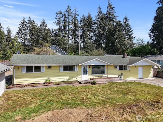 single story home with driveway and a front yard