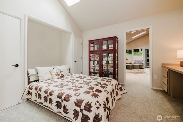 bedroom with light carpet and lofted ceiling