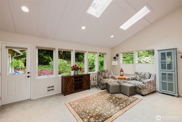 living room with recessed lighting, light colored carpet, and a healthy amount of sunlight